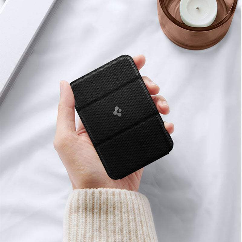 Black magnetic card holder attached to an iPhone with a simple design mobile phone accessory