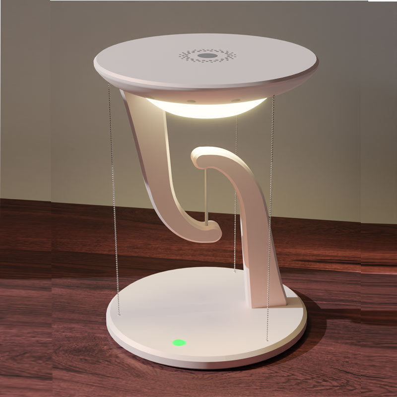 Modern table lamp with a unique design on a wooden floor.